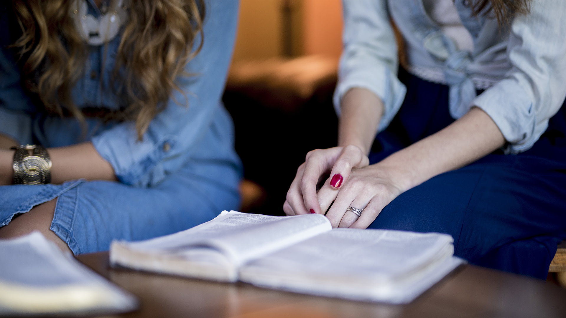 Women's hands on Bible