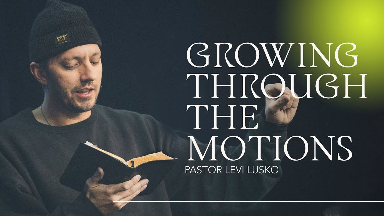 Levi Lusko holding a Bible teaching Growing through the motions