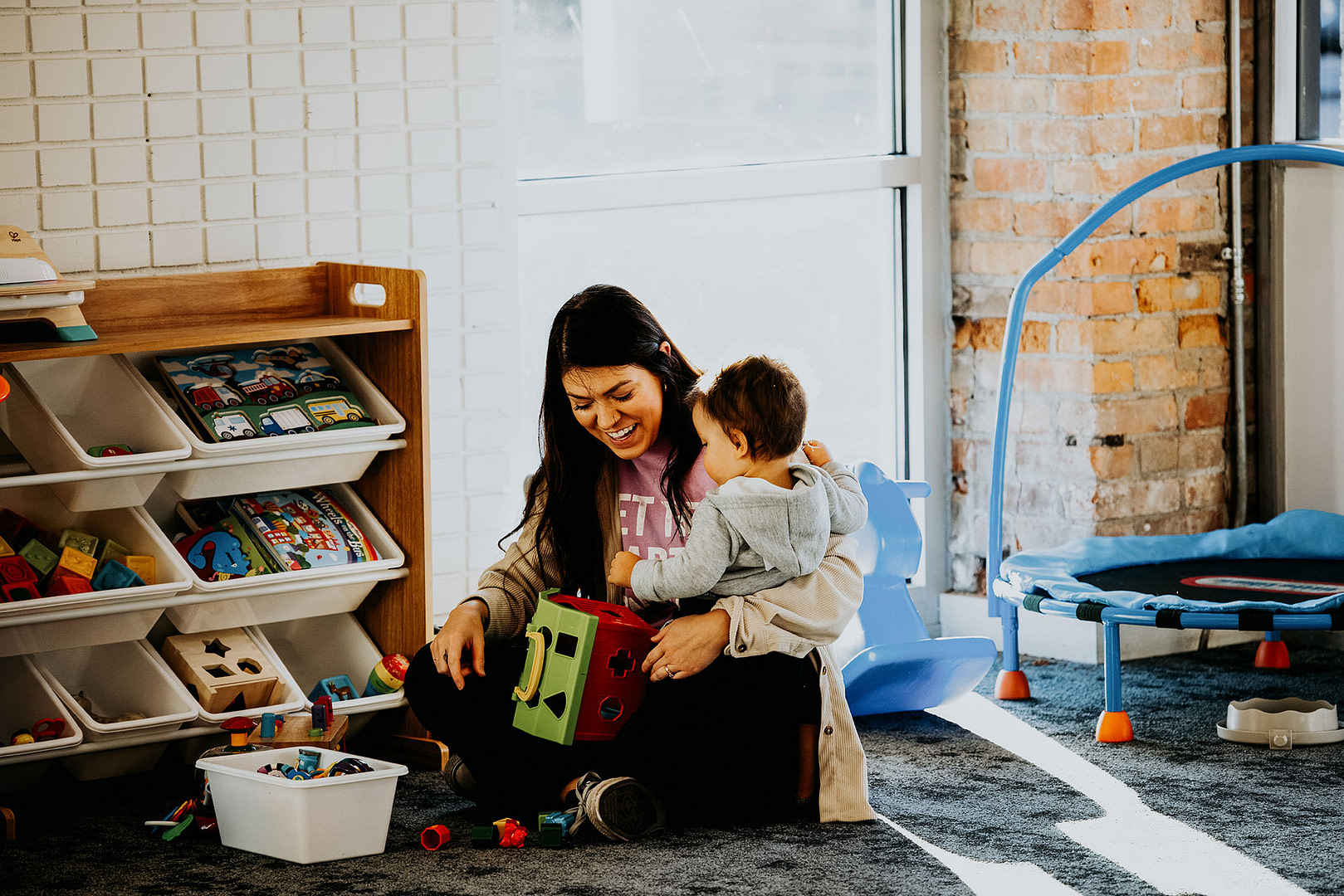 Woman and child in playroom