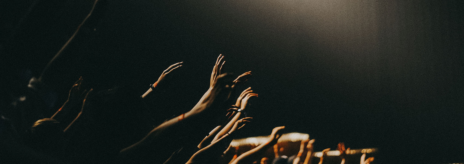 People with their hands in the air.