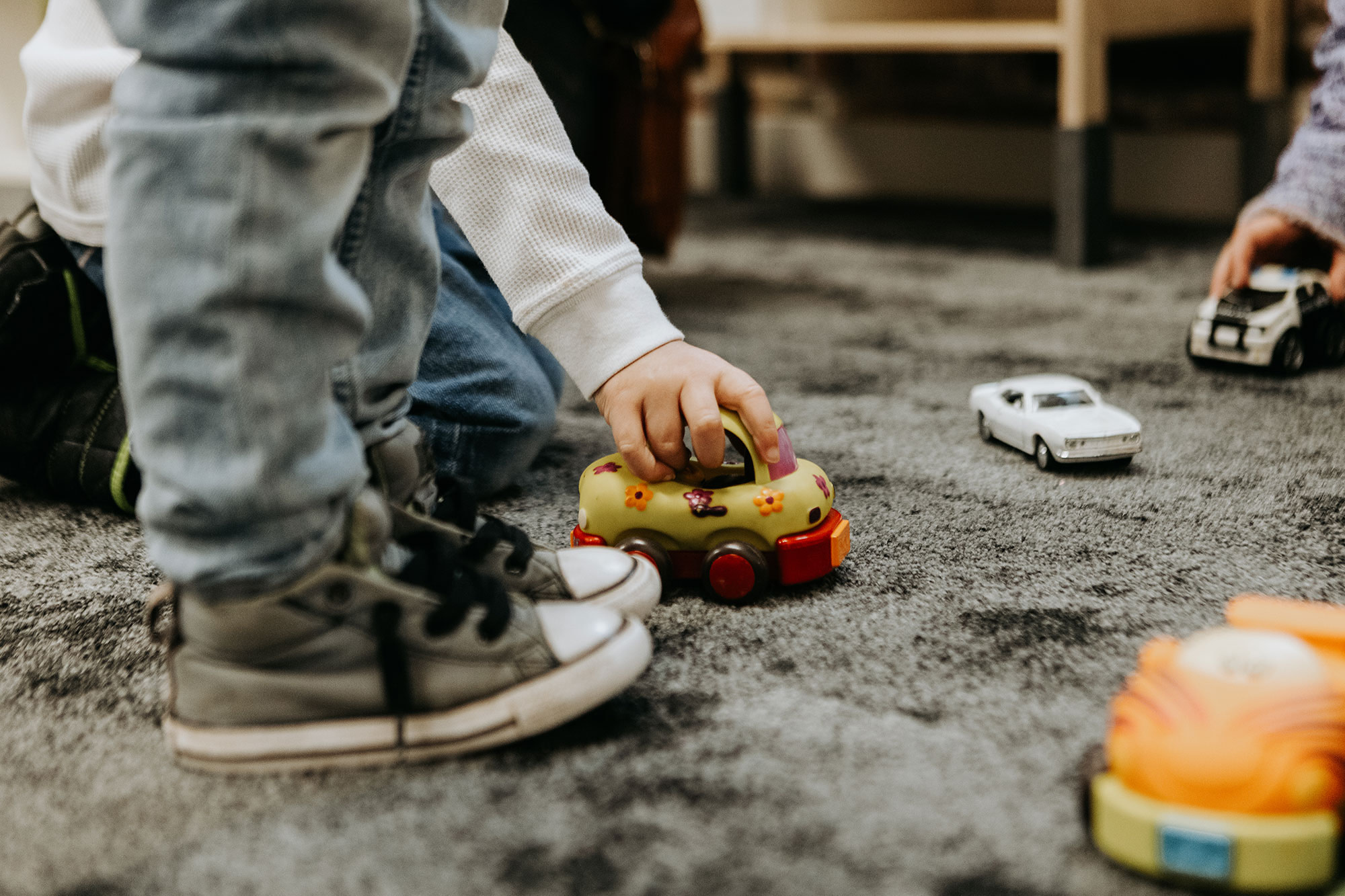 Children playing with toy cars