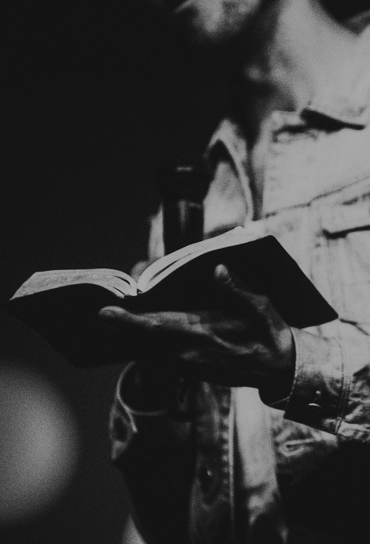 Person holding a Bible