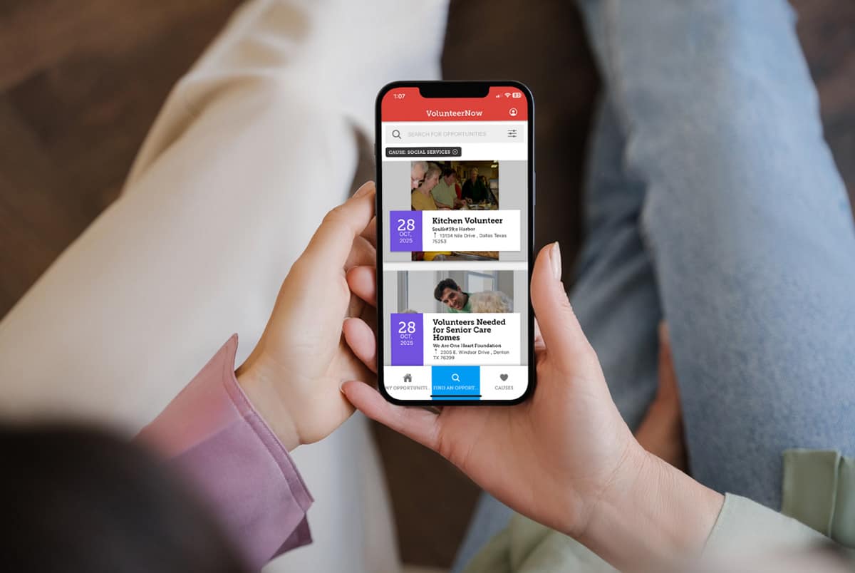 Person browsing volunteer opportunities on mobile app.