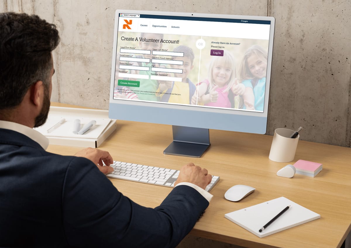 Man creating volunteer account on desktop computer