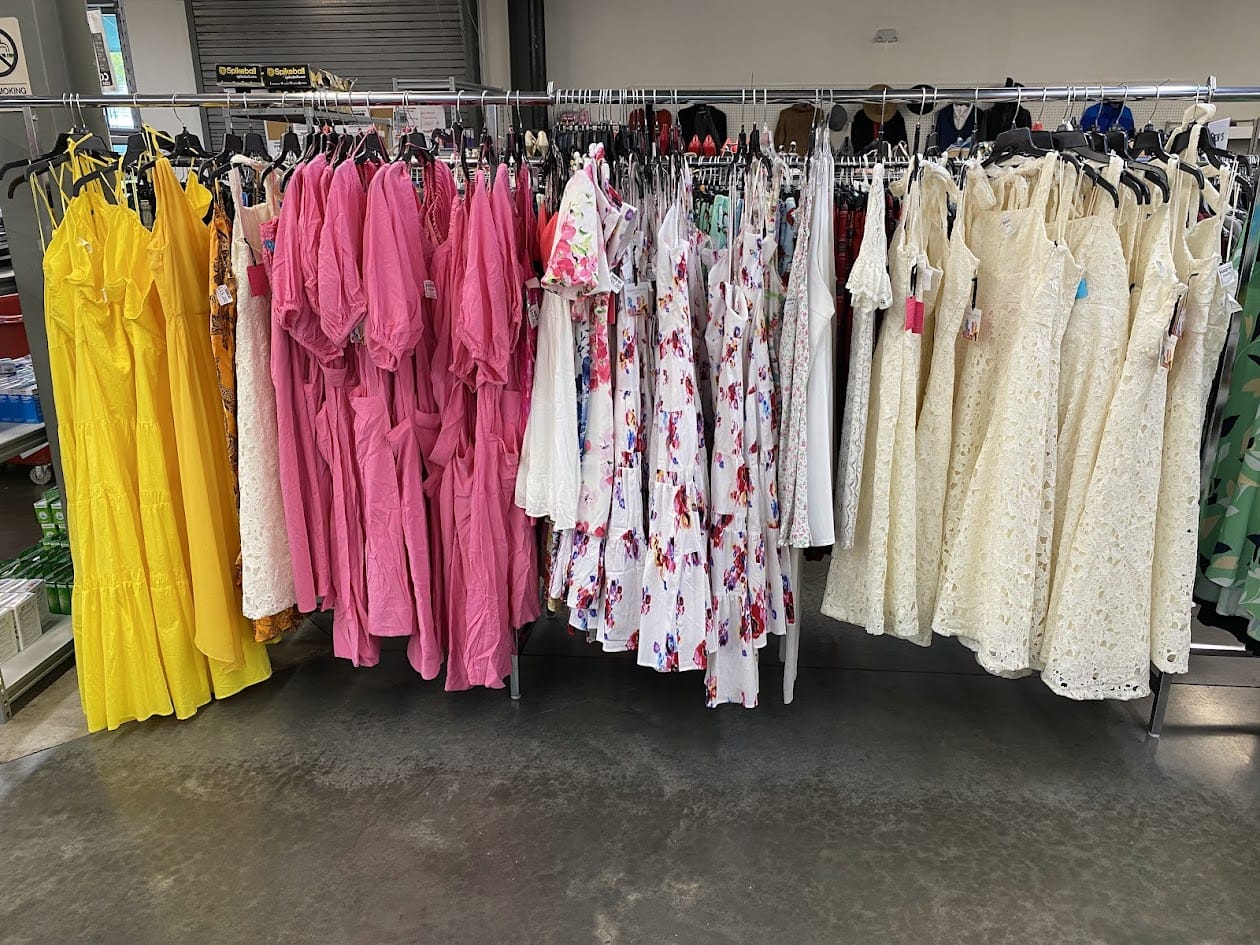 Colorful dresses on clothing rack in store