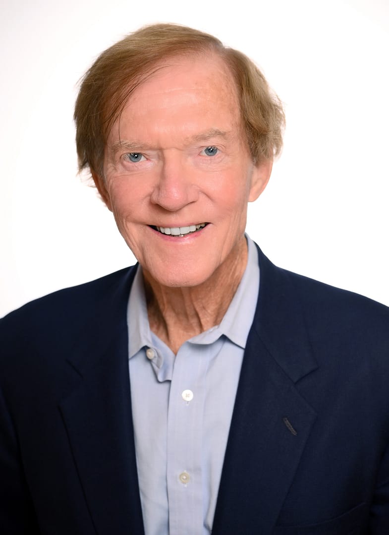 Smiling man in a suit and shirt